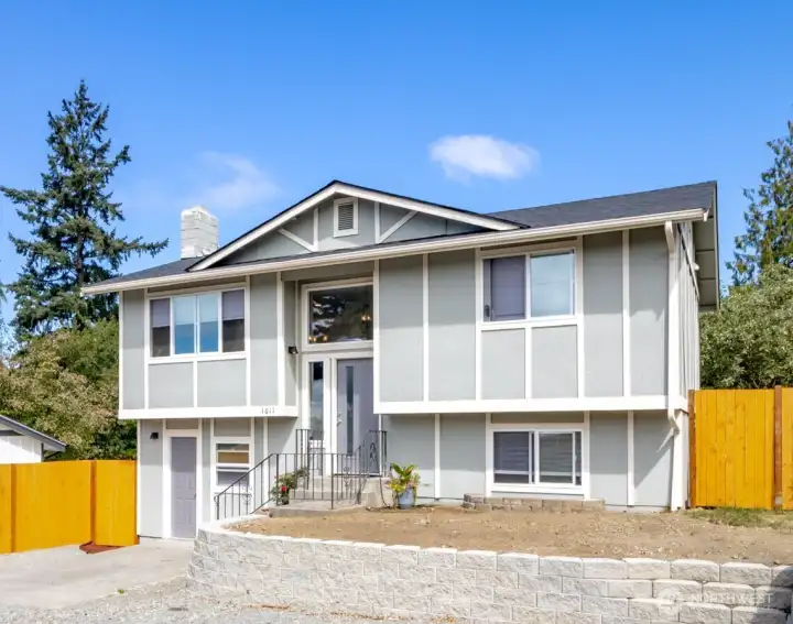 Welcome Home! New roof, lots of parking and very low maintenance yard