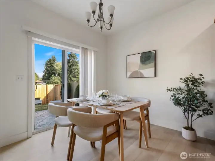 Dining area opens to the back patio.