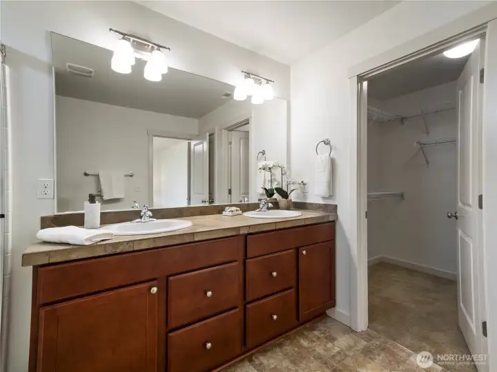 The primary bathroom includes a nice, walk-in closet and linen closet for extra storage.