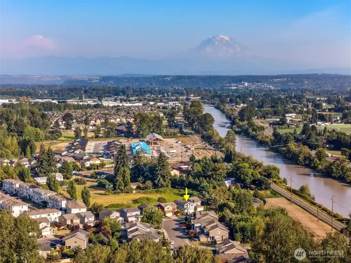 Mount Rainier and the Cascade foothills can be seen off in the distance.