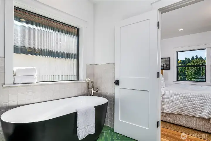 With separate soaking tub.