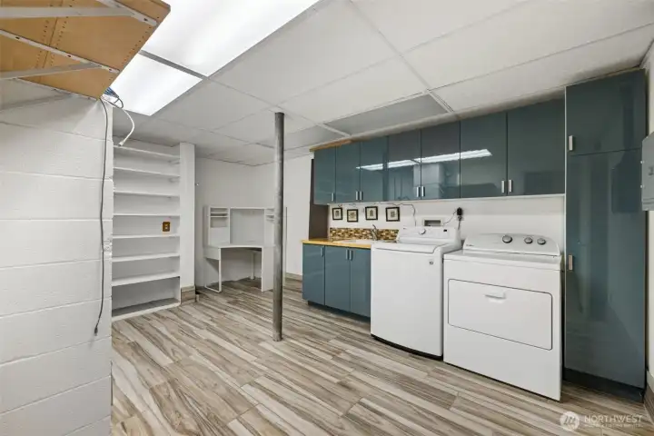 “Dream laundry room with space to build a second kitchen—or let your imagination run wild.”