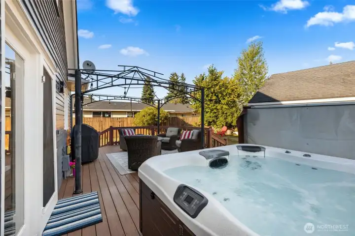 “Relax on the deck, soak in the hot tub, and enjoy a private fenced yard.”