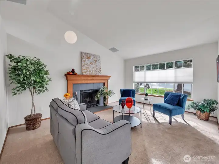 Alternate view of living area showcasing large picture window.