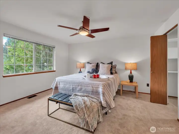 Spacious primary suite with walk-in closet