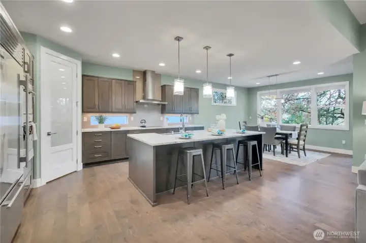 Chefs kitchen! SubZero & Wolf appliances.  Quartz Counters.  Walk-in pantry with 20+ shelves! Formal space for dining as well as breakfast bar.