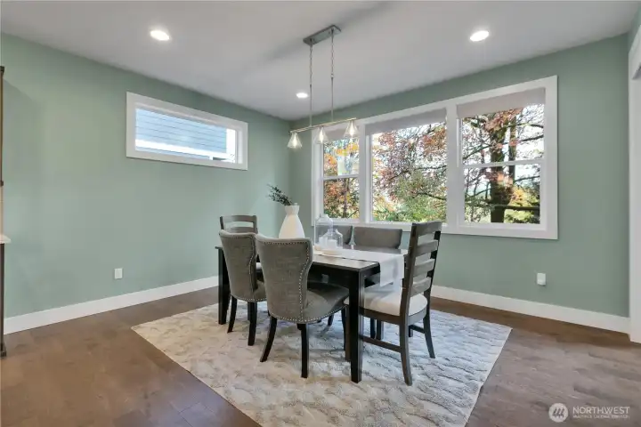 Flexible formal dining space with windows galore. Slider to covered porch is just to the right. Note all windows are wood wrapped.
