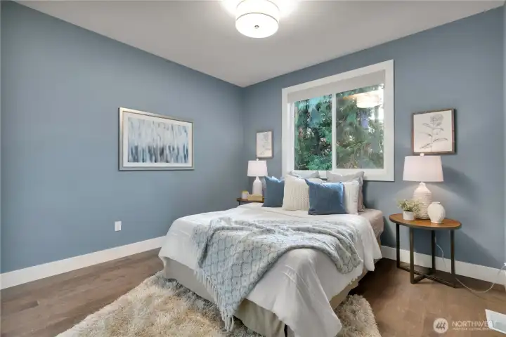 One of two additional bedrooms.  Remote blinds; engineered hardwood flooring.  Cozy yet spacious!  Full bath just next door!