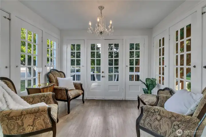Sunroom with French doors that open to the side deck