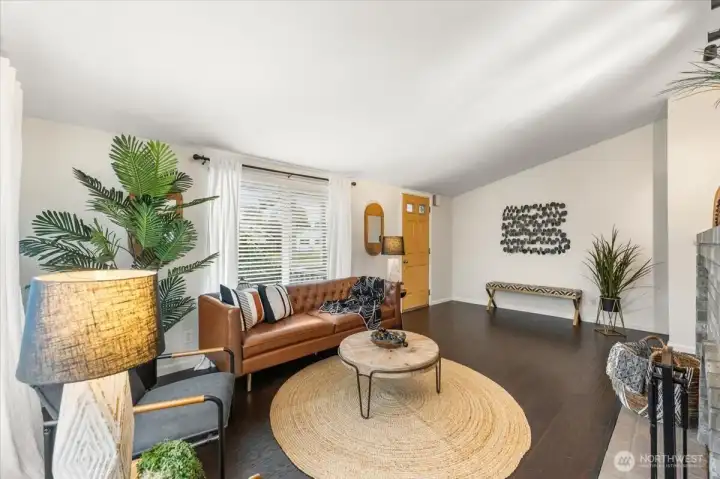Alternate angle showcasing the open layout and natural light in the living room.