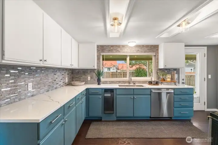Plenty of cabinetry paired with ample counter space ensures effortless cooking and organization.