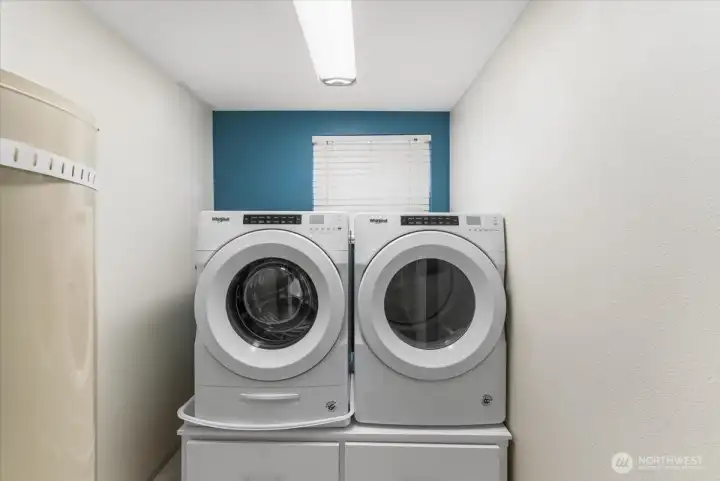 Full size front loading washer and dryer remain with the sale of this home.