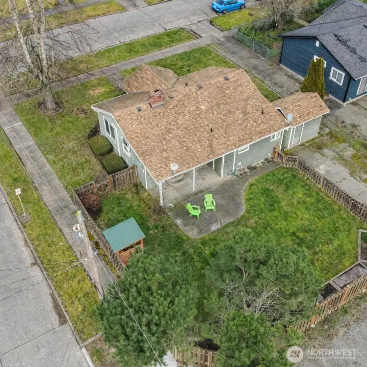 Aerial view of this well maintained home located on a corner lot.