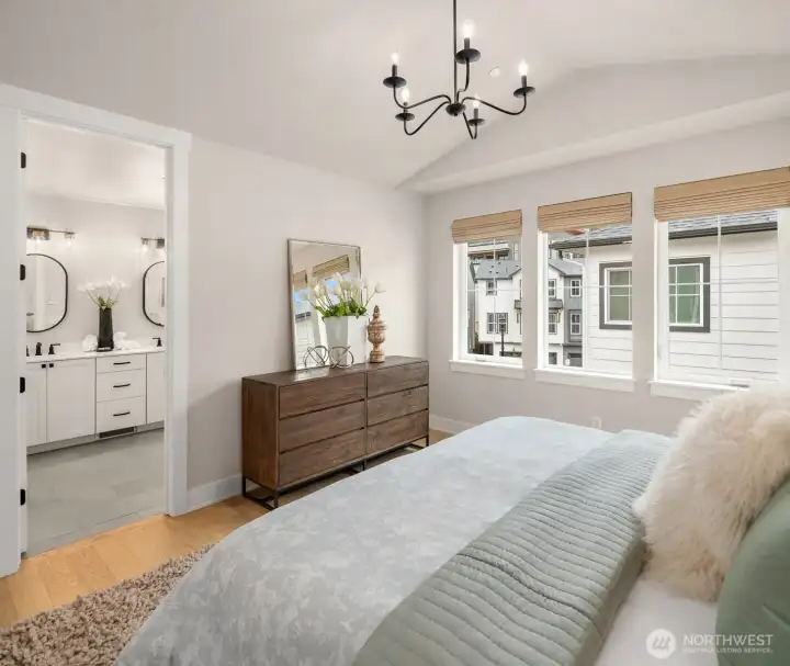 Light-filled primary suite with vaulted ceilings and spa-inspired ensuite bath.