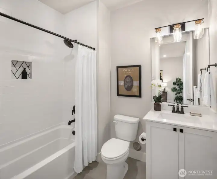 Convenient lower-level bathroom with modern finishes and full tub & shower.