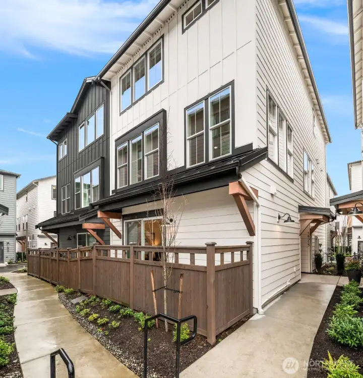 Private side patio space perfect for relaxing or outdoor dining.