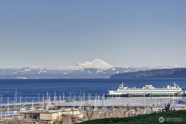 Welcome…soak in captivating views of Puget Sound, shimmering city lights, and majestic Mount Baker from this exceptional home.