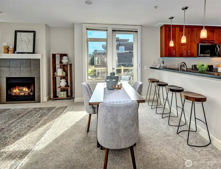 Entertain with ease: dining area opens via French door to a sprawling, sunlit deck, creating a wonderful extension of living space.
