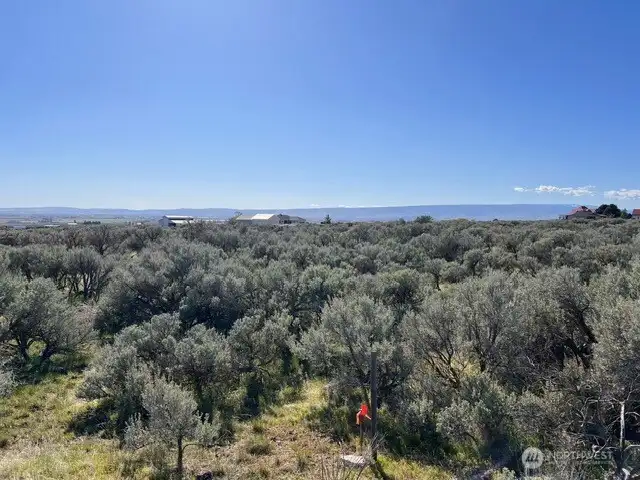 One of the four corners clearly marked. View looking South.