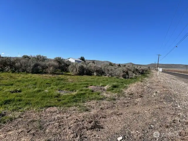 View looking North from South East corner of property and up Adams Road NW.