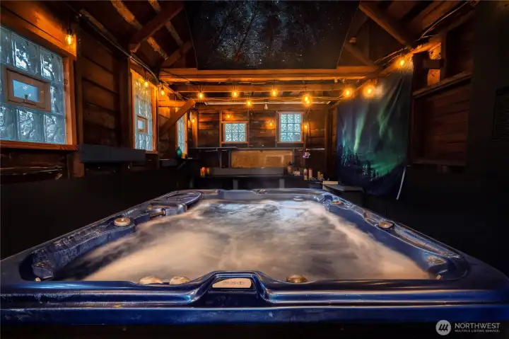 A newer hot tub elevates the home with a spa-inspired enclosed retreat featuring overhead lighting, a cooling fan, and remote-controlled candles—perfect for luxury relaxation in every season!