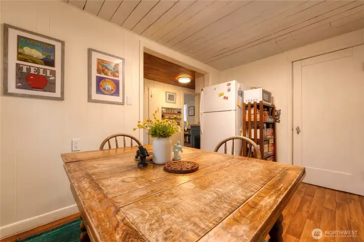 Designated dining room off kitchen ~ where dinner ends and game night begins.  Shelving offers a full collection of games and puzzles.