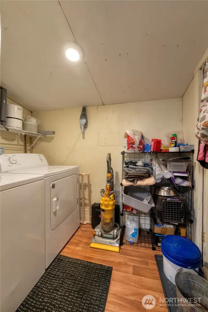 Laundry/storage room with full size washer and dryer and handy access to your back yard.