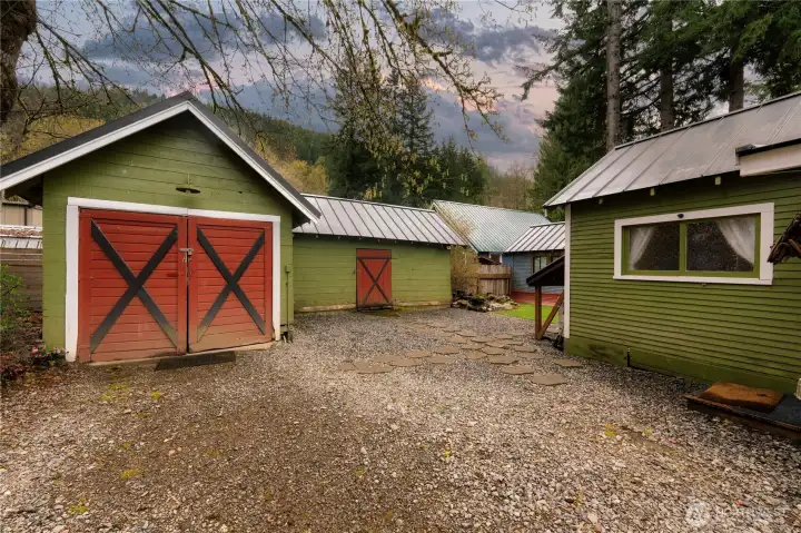 The detached garage has been reimagined as a relaxing retreat, complete with spa room to enjoy after a day of adventure.  Adjacent to the right, a separate workshop and gear storage area provides practical space for tools, hobbies, or equipment, with a dividing wall that keeps uses distinct and organized.