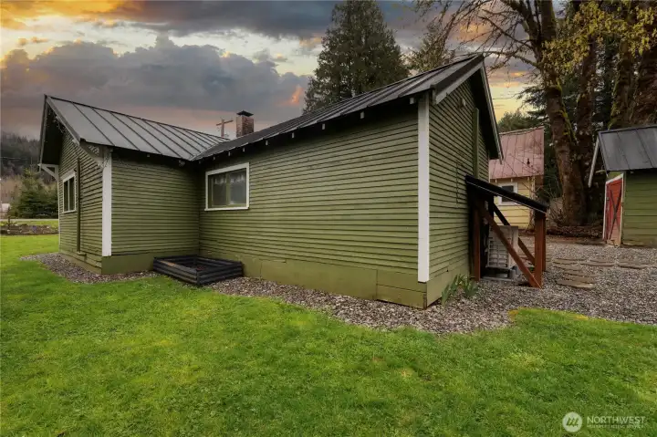 A carefully curated juniper green palette was selected to honor the home's era and natural surroundings.