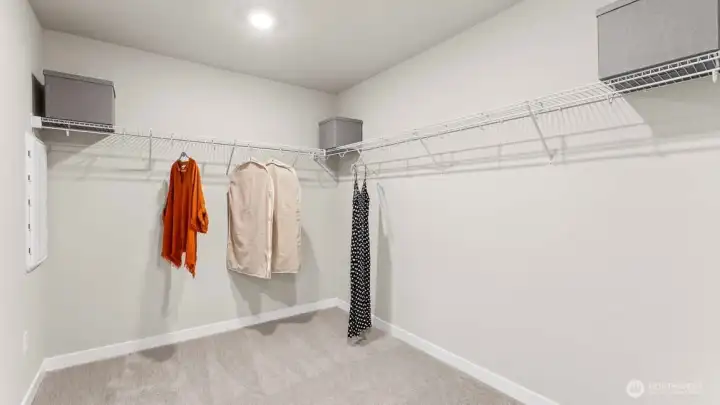 Primary suite walk-in closet. Picture for representational purposes only, colors and features may vary. Primary suite walk-in closet. Picture for representational purposes only, colors and features may vary.