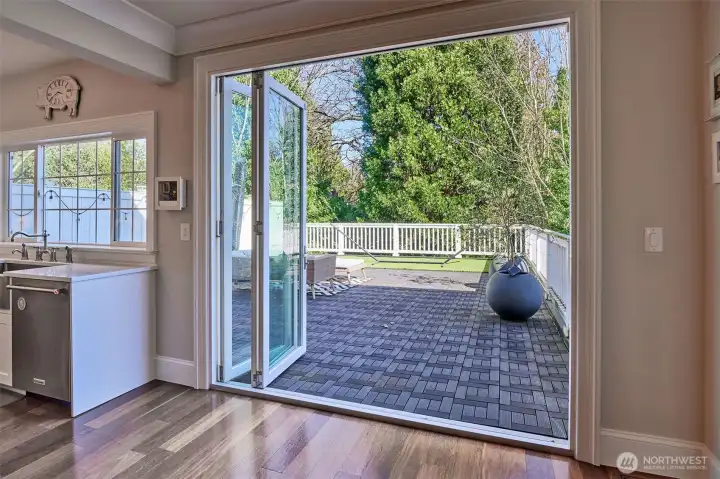 folding glass doors lead to the enormous deck