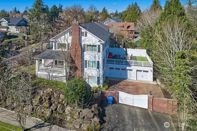 Security gates lead you to space for off street parking and 780 sqft 3+ garage!
