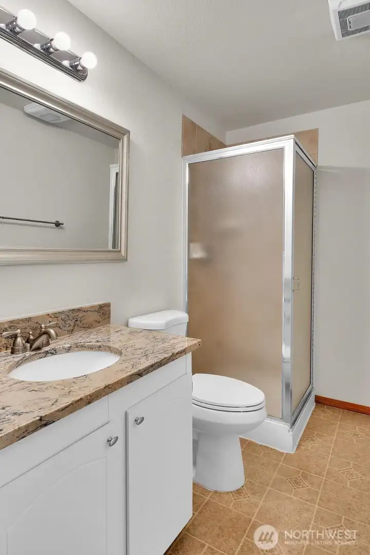 Primary bath with granite counters.