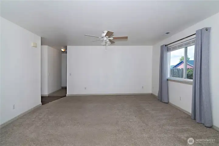 Living room with easy transition to the bedroom wing of the home.