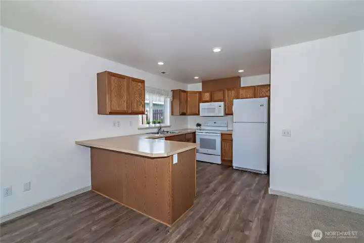 Kitchen with dining area and even room for seating at the counter.