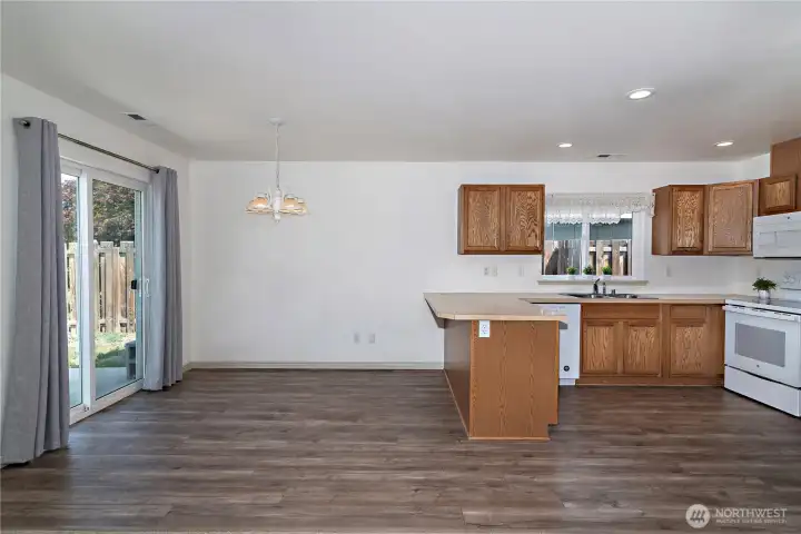 Kitchen offers open sight lines to living room.