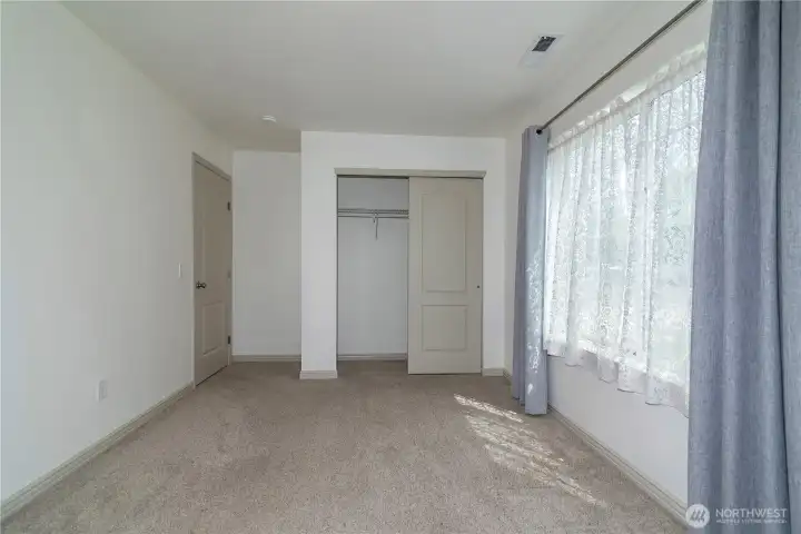3rd bedroom ~ The natural light in this home continues throughout.