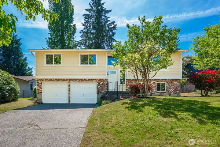Lovely split-level home with beautiful landscape now available