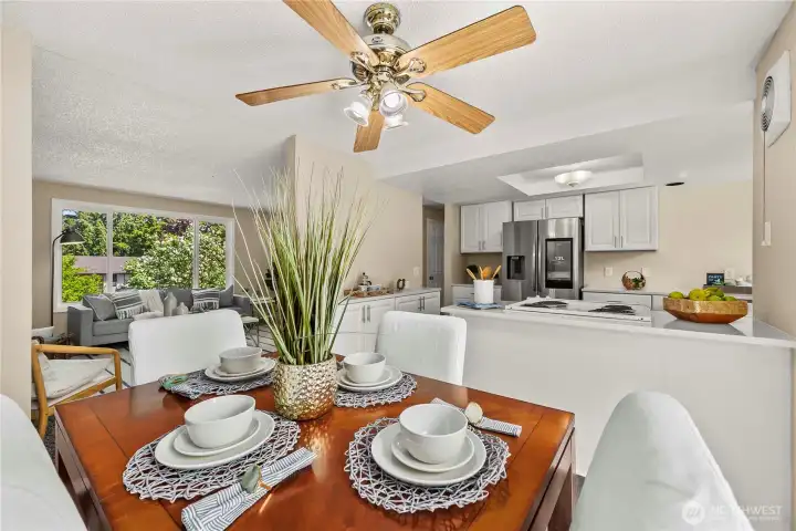 Circular floor plan opens the kitchen to the dining area and fireside living room