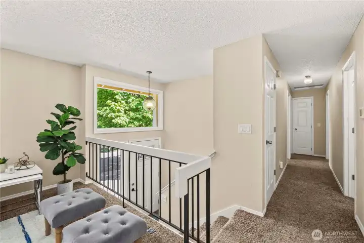 Down the hall is the primary suite, 2 additional bedrooms and full bath.