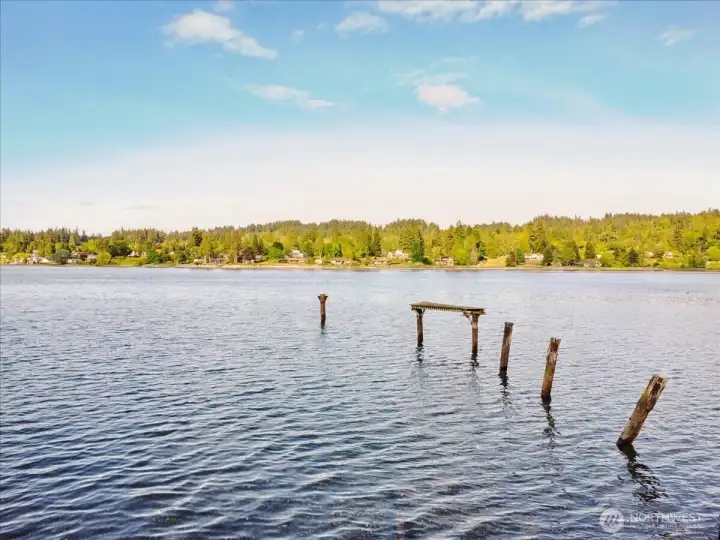 Enjoy the gorgeous sunrise and sunsets from your own private waterfront. Piers remain from the old dock and have value: the existing piers makes is much easier to build a new dock! Just a few steps and you can launch your kayak or paddleboard right from your own beach!