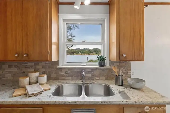Amazing view makes doing the dishes fun! Digitally Staged.