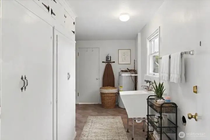 Utility room with deep sink. Digitally Staged.