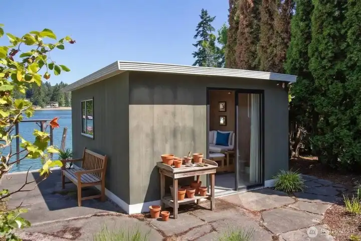 Bonus outbuilding would make a great workshop, art studio or home office! Digitally Staged.