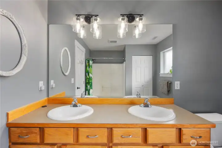 Primary Bathroom with Dual Sink Vanity and Full Tub + Shower