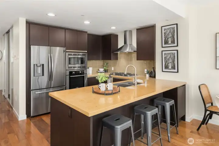 This stylish kitchen provides abundant cabinetry & countertop space, quality appliances with smart fridge, & functional design. This stylish kitchen provides abundant cabinetry & countertop space, quality appliances with smart fridge, & functional design.