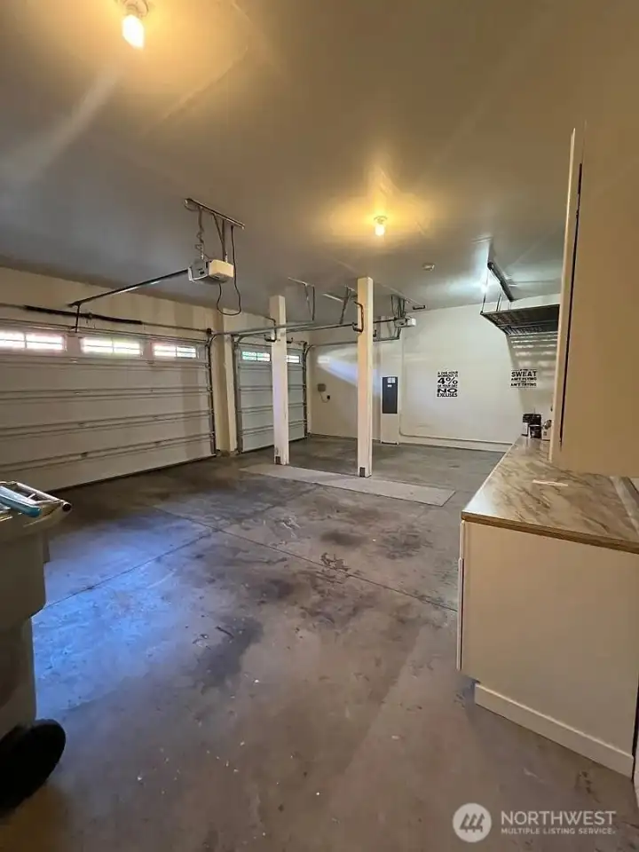 3 Car garage with lot of cabinets and storage