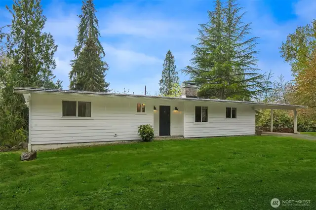 Recently updated daylight rambler on nearly 3 acres!