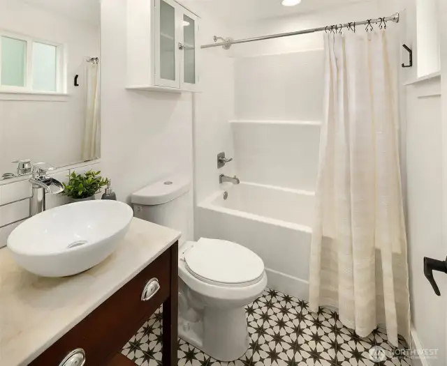 Attached bathroom to the primary is modern and fresh!