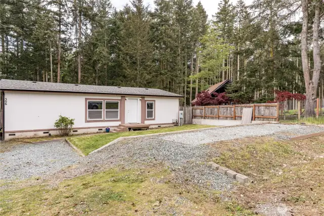 Tucked away at the end of Ocean View.  Treed acreage behind.  Gravel pad in front with electrical ran to it.